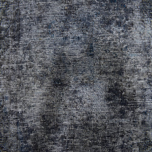 Backside of overdyed vintage Persian rug showing traditional hand knotted construction
