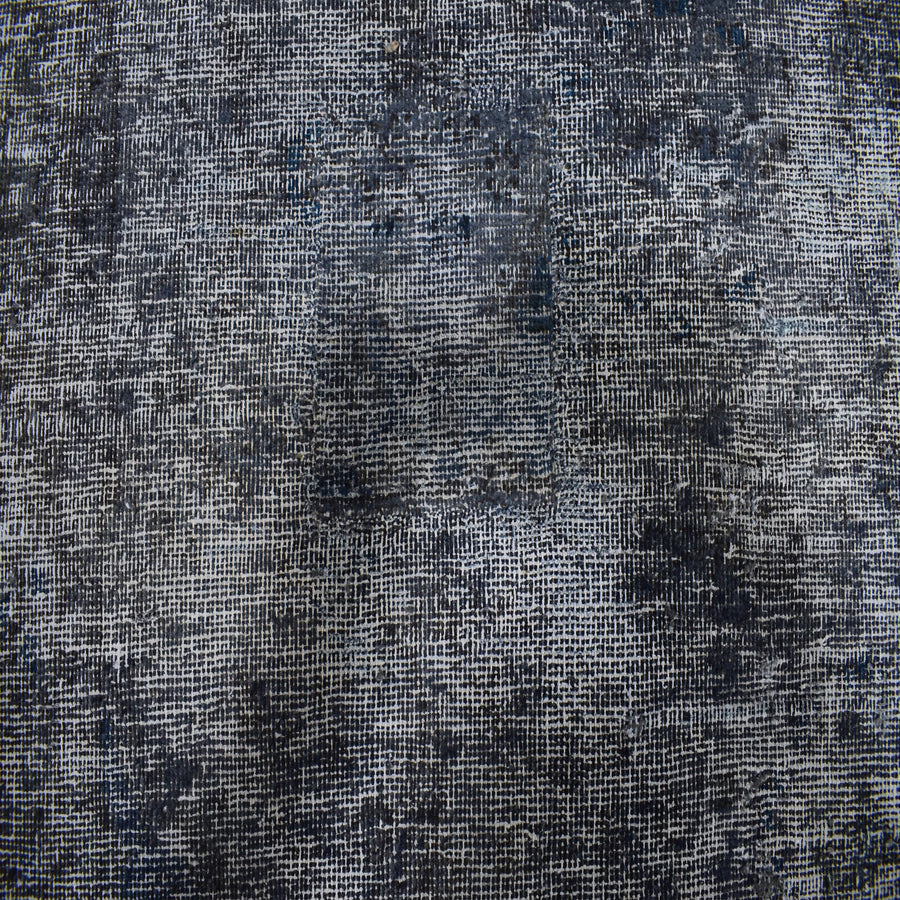 Backside of overdyed vintage Persian rug showing traditional hand knotted construction
