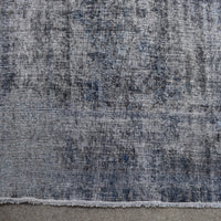 Detailed pile texture of grey blue overdyed Persian rug showing authentic wool foundation
