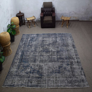 Large overdyed vintage Persian rug 288x322 cm full view showing faded traditional pattern beneath grey wash
