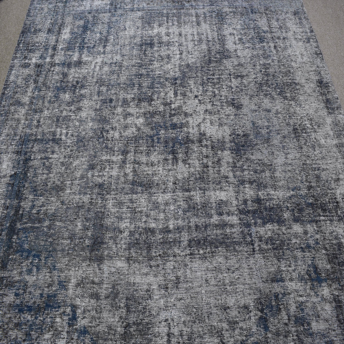 Overdyed Persian rug with antique distressed look and cool grey tonal variations
