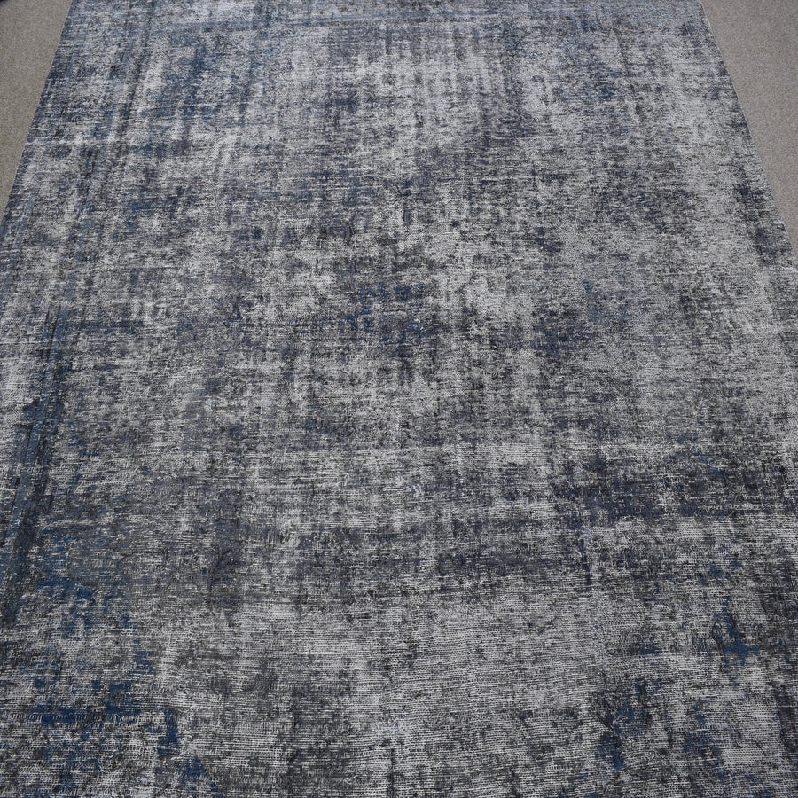 Overdyed Persian rug with antique distressed look and cool grey tonal variations
