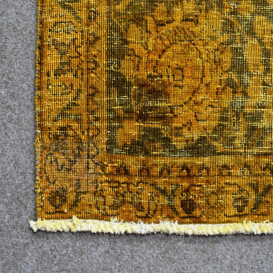 Backside of overdyed vintage Persian rug showing traditional hand knotted construction
