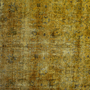 Close-up of overdyed vintage Persian rug showing textured wool pile and mottled gold tones
