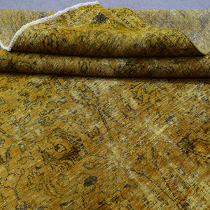 Edge detail of hand knotted overdyed Persian rug with visible binding and tonal shading
